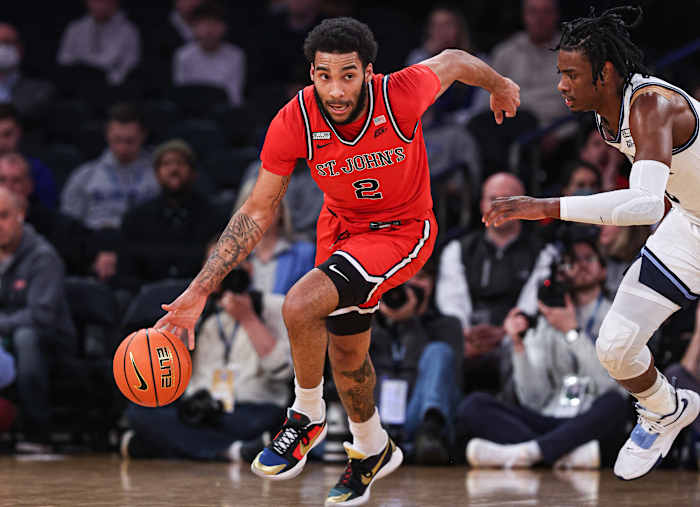 St. John's Red Storm guard Julian Champagnie (2) dribbles up court against Villanova Wildcats forward Brandon Slater (3) during the first half at Madison Square Garden.
